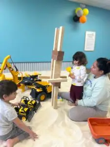 Calm and Relaxed parent enjoys their child's creativity.