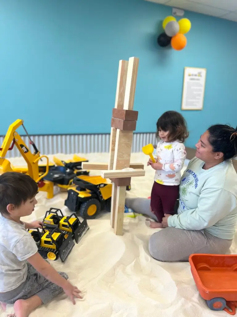 Calm and Relaxed parent enjoys their child's creativity.