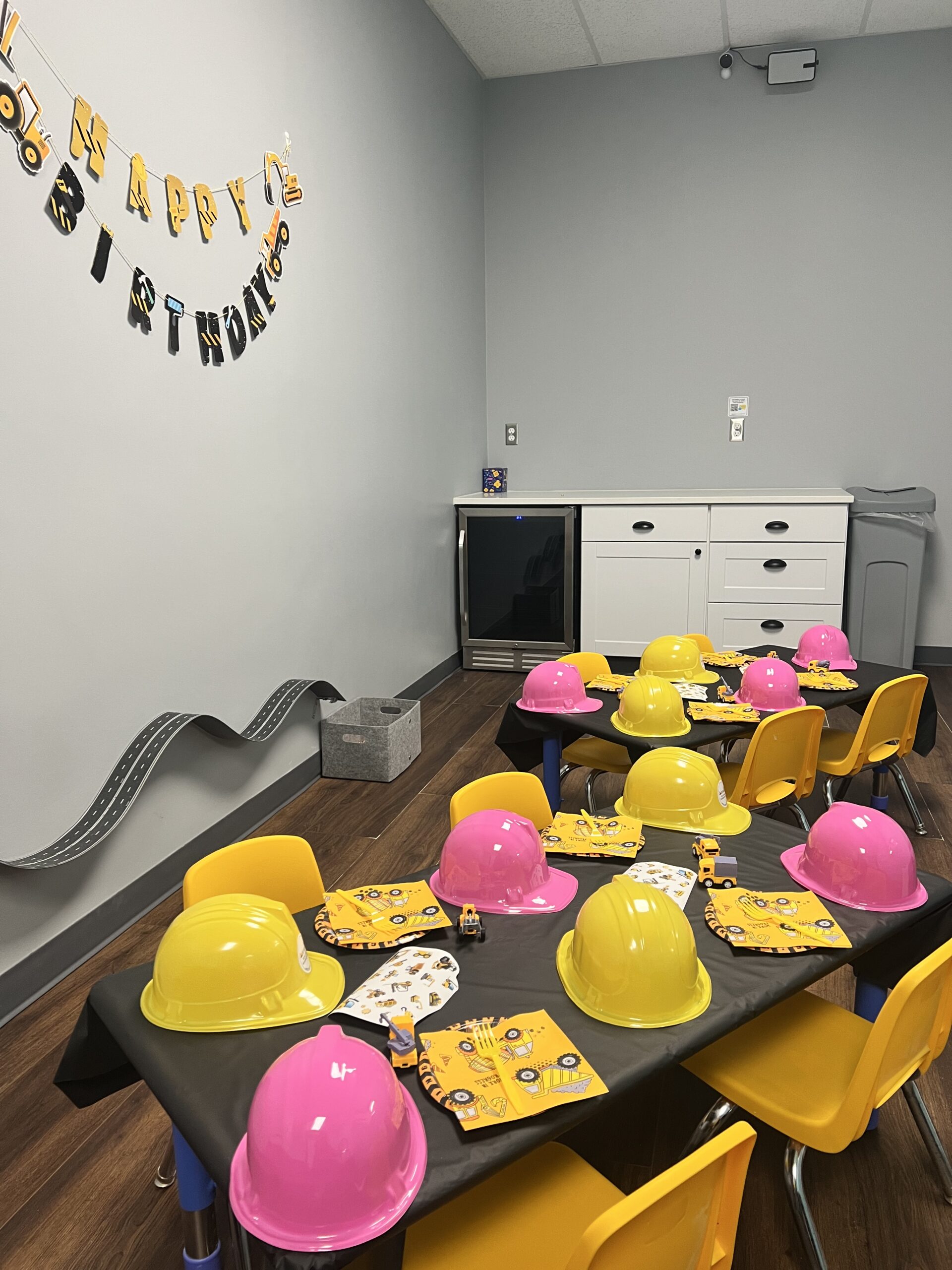 Kids shoveling sand at indoor playground near Denver Colorado