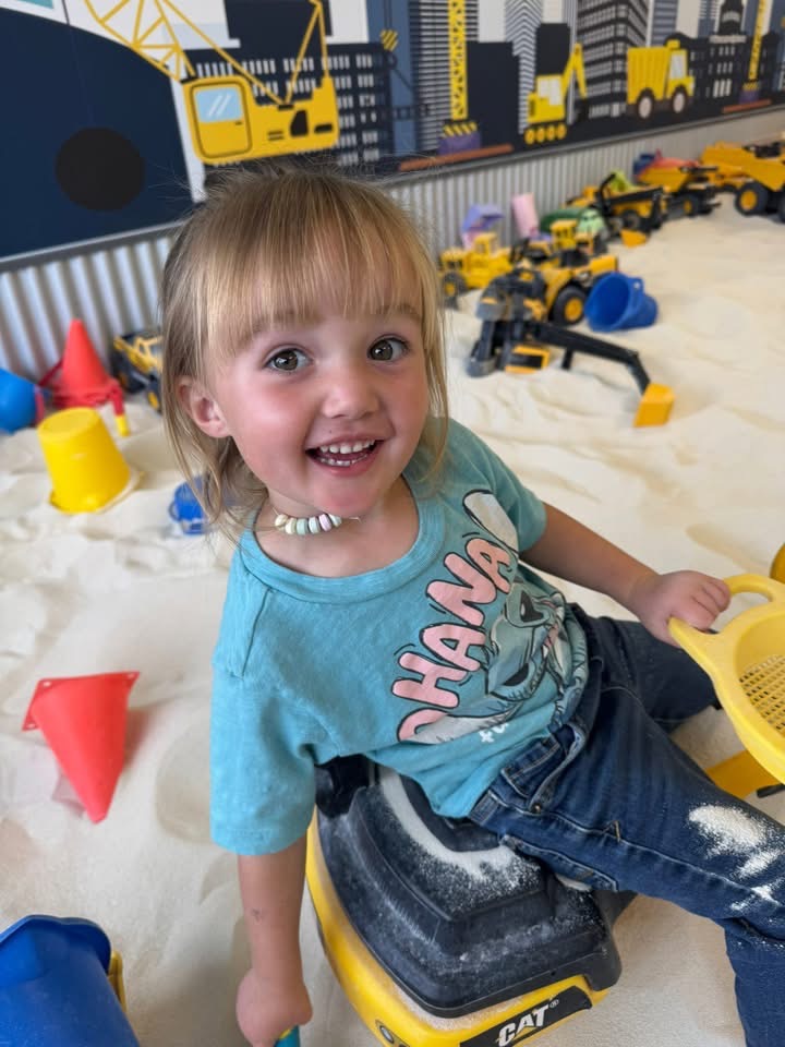 Children digging in indoor sandbox at The Sand Place in Aurora CO