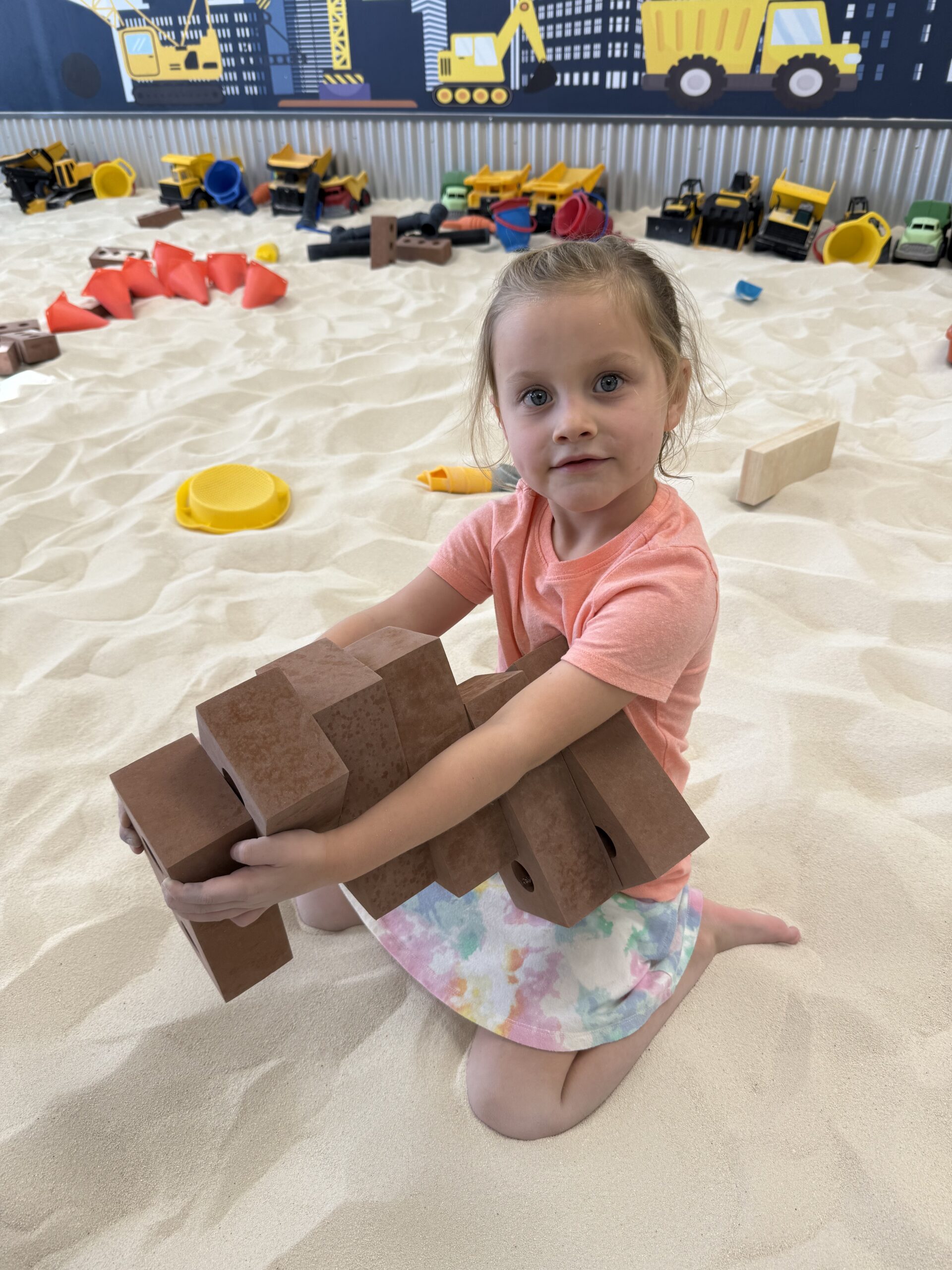 Birthday party group photo at The Sand Place indoor playground near Denver