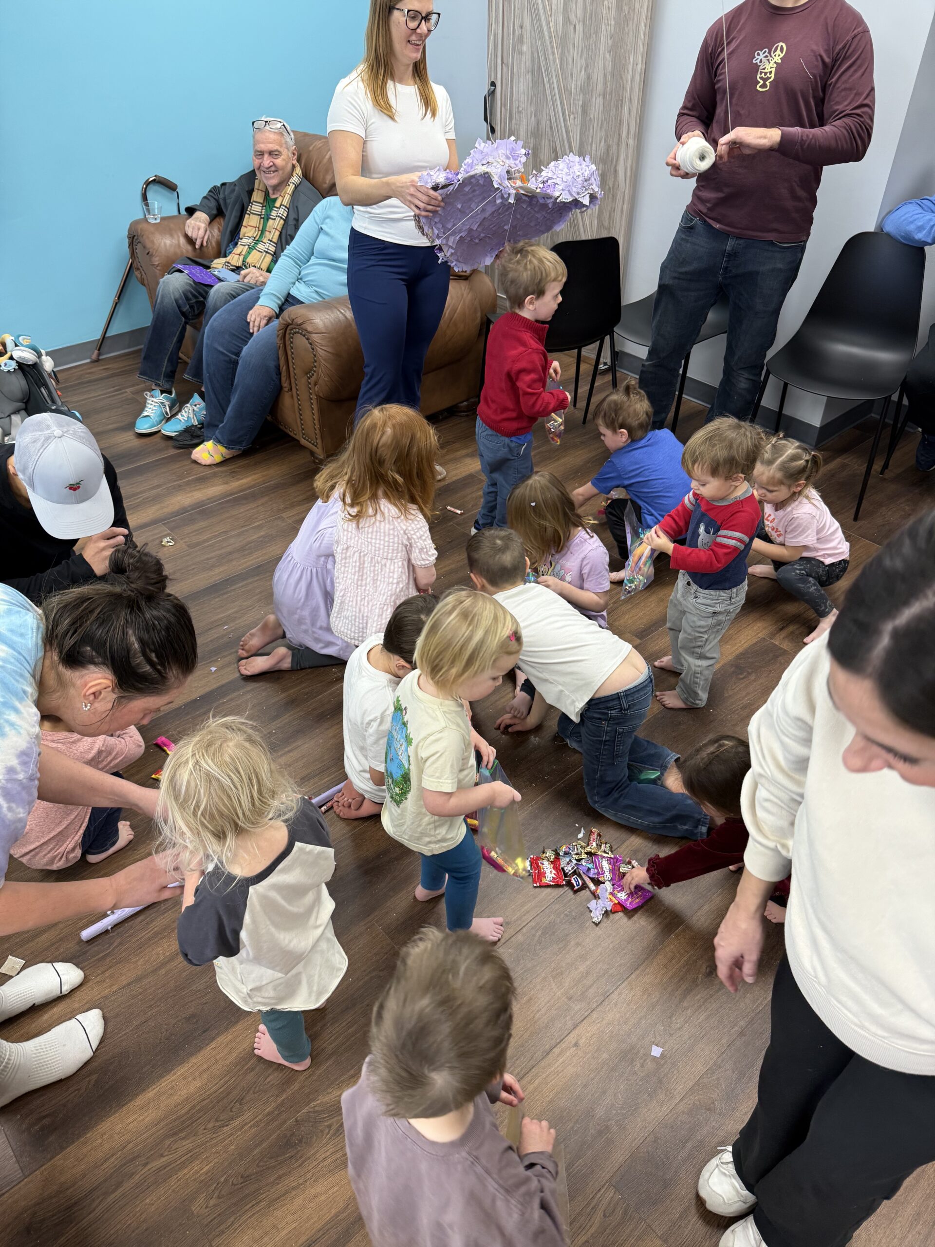 Kids laughing during birthday party at indoor sandbox venue in Aurora Colorado
