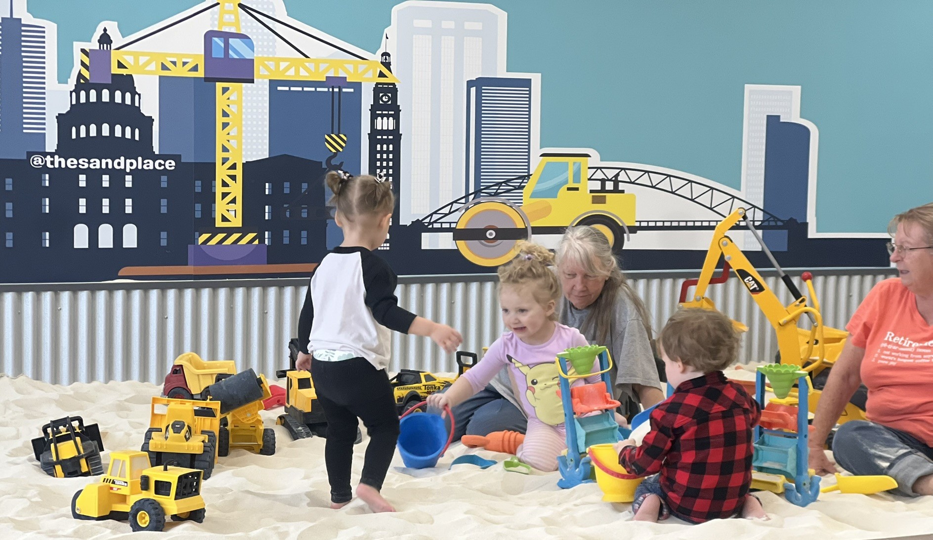 Group of kids at indoor sand playground birthday party in Aurora CO