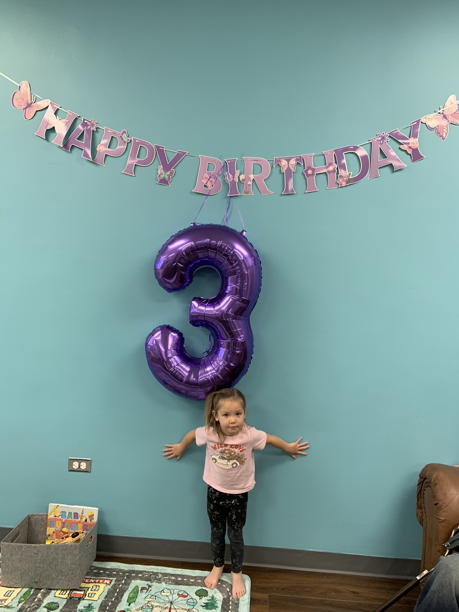 Child building sandcastle at indoor playground near Parker Colorado